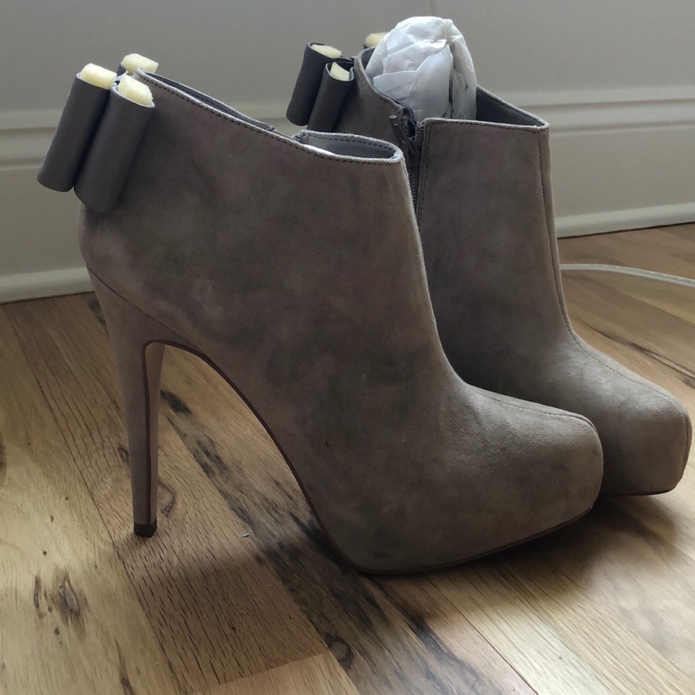Brand new DV boots with bows
